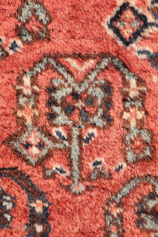 A lovely antique Luri rug with a field filled with elegantly rendered palmettes, arranged diagonally by colour. The spaces left between the main motifs are enriched with scattered decorative elements.. The navy ...