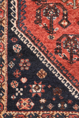 A lovely antique Luri rug with a field filled with elegantly rendered palmettes, arranged diagonally by colour. The spaces left between the main motifs are enriched with scattered decorative elements.. The navy ...