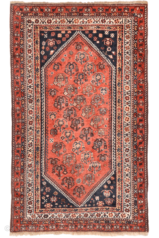 A lovely antique Luri rug with a field filled with elegantly rendered palmettes, arranged diagonally by colour. The spaces left between the main motifs are enriched with scattered decorative elements.. The navy ...