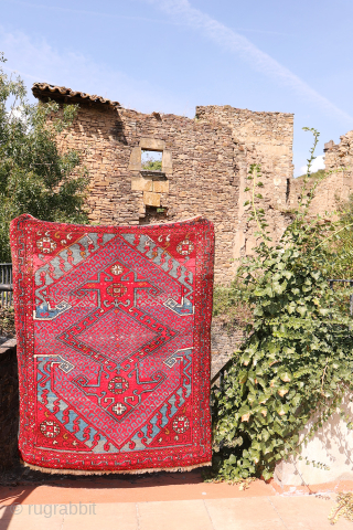 A wonderfully thick and plush antique Bergama rug, with a beautiful range of colours and an unmistakable village character. A deep indigo blue runs throughout the composition, brought to life by the  ...