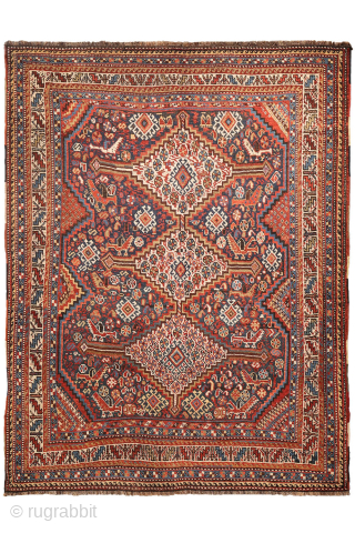 An antique Khamseh rug featuring three large medallions arranged horizontally, extending almost to the rug’s borders. The deep navy-blue field is richly decorated with birds, botehs, S-shaped motifs, and delicate vegetal elements.

The  ...