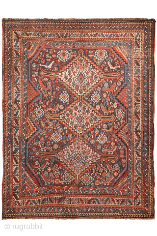 An antique Khamseh rug featuring three large medallions arranged horizontally, extending almost to the rug’s borders. The deep navy-blue field is richly decorated with birds, botehs, S-shaped motifs, and delicate vegetal elements.

The  ...