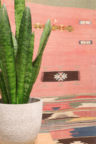 This antique Balikesir kilim features a rare and distinctive design, reminiscent of some early 1800s Balikesir Yuncu kilims. The central field is adorned with enigmatic motifs, seemingly depicting small, intricate rugs. The  ...