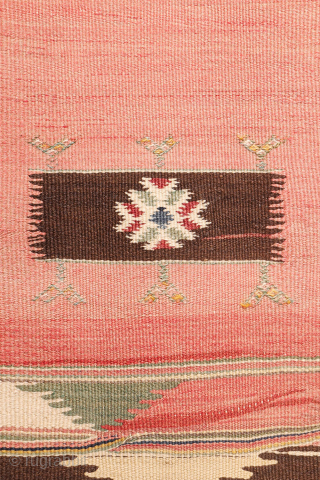 This antique Balikesir kilim features a rare and distinctive design, reminiscent of some early 1800s Balikesir Yuncu kilims. The central field is adorned with enigmatic motifs, seemingly depicting small, intricate rugs. The  ...