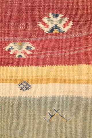 This antique Balikesir kilim features a rare and distinctive design, reminiscent of some early 1800s Balikesir Yuncu kilims. The central field is adorned with enigmatic motifs, seemingly depicting small, intricate rugs. The  ...