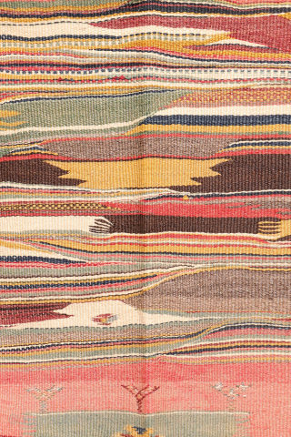 This antique Balikesir kilim features a rare and distinctive design, reminiscent of some early 1800s Balikesir Yuncu kilims. The central field is adorned with enigmatic motifs, seemingly depicting small, intricate rugs. The  ...