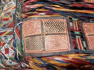 Tuareg leather womans travel bag ("aghrig"), with hand worked and dyed leather, probably goat skin. Intricate leather work with check pattern cut into dyed skin. The green dyed leather colour is considered  ...