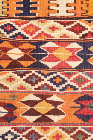 This  Qashqai kilim features a horizontal layout made up of bands of varying widths. Within these bands, the weaver incorporated a variety of traditional motifs — most notably the “comb” motif,  ...