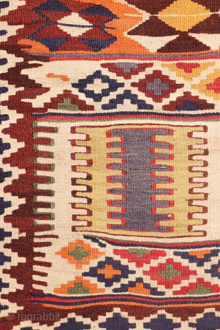 This  Qashqai kilim features a horizontal layout made up of bands of varying widths. Within these bands, the weaver incorporated a variety of traditional motifs — most notably the “comb” motif,  ...