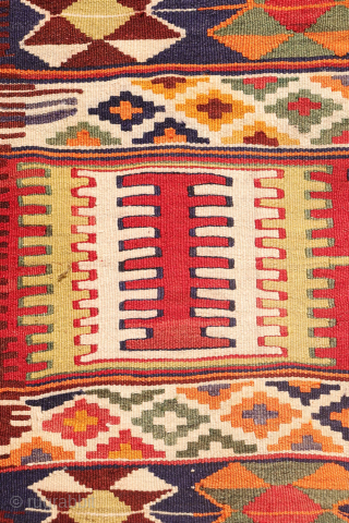 This  Qashqai kilim features a horizontal layout made up of bands of varying widths. Within these bands, the weaver incorporated a variety of traditional motifs — most notably the “comb” motif,  ...
