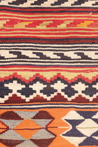 This  Qashqai kilim features a horizontal layout made up of bands of varying widths. Within these bands, the weaver incorporated a variety of traditional motifs — most notably the “comb” motif,  ...