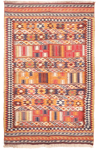 This  Qashqai kilim features a horizontal layout made up of bands of varying widths. Within these bands, the weaver incorporated a variety of traditional motifs — most notably the “comb” motif,  ...