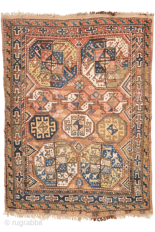 A North West Persian Kurdish rug featuring an oversized design with a large octagon placed in each corner. The central field contains smaller secondary motifs, creating a structured yet lively arrangement.

While the  ...