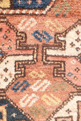 A North West Persian Kurdish rug featuring an oversized design with a large octagon placed in each corner. The central field contains smaller secondary motifs, creating a structured yet lively arrangement.

While the  ...