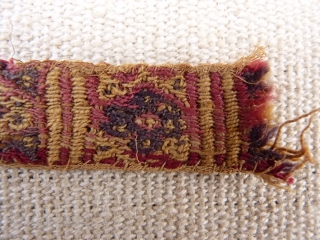 A Huari Culture band, 8th to 12th century, Huari Culture , South Central Perú. Wool. From a Spanish private collection. 39x2,8 cms. (T1511011)          