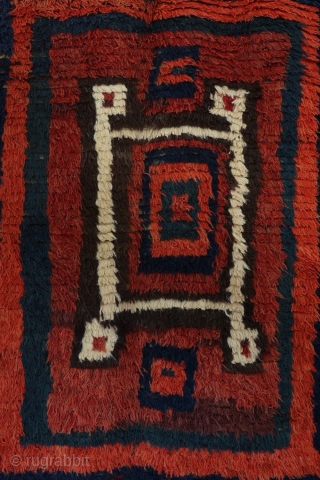 The design of this shaggy antique Uzbek sleeping rug (Julkhyr) is stunning, very rough, bold and archaic, featuring a huge central motif in the form of concentric squares.

The border, in a way,  ...