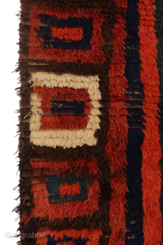 The design of this shaggy antique Uzbek sleeping rug (Julkhyr) is stunning, very rough, bold and archaic, featuring a huge central motif in the form of concentric squares.

The border, in a way,  ...