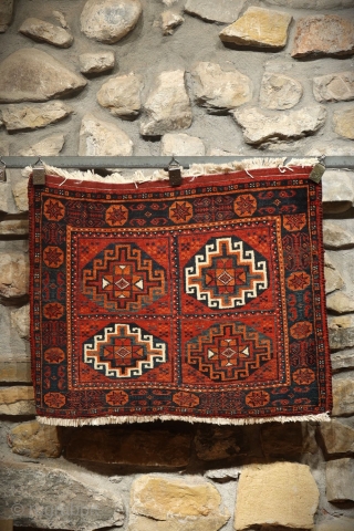 rug from the Baluch tribe, Iran. This poshti or pushti  has an unusual design and the colors are also unusual and include blue and ochre. The border is made up of  ...