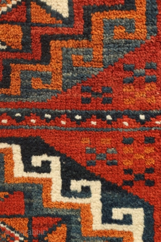 rug from the Baluch tribe, Iran. This poshti or pushti  has an unusual design and the colors are also unusual and include blue and ochre. The border is made up of  ...