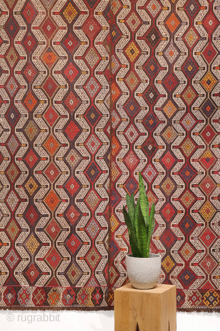 An Adana kilim with a distinct tribal character.
This Adana kilim is woven on an undyed brown wool background and decorated using the cicim technique. While the weaver created a repetitive pattern, she ...