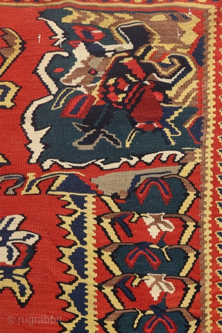 Antique kilim from Senneh, Iran. This kilim woven by Kurdish people of Sanandaj is very finelly woven and using only natural dyes. The curvilinear floral motifs are typical of this area.You can  ...