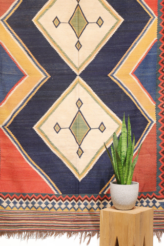 Antique minimalist Qashqai Kilim with Striking Blue
This remarkable 1920s Qashqai kilim is distinguished by the predominance of dark blue, achieved entirely with natural dyes. The weaver created a simple yet visually striking ...