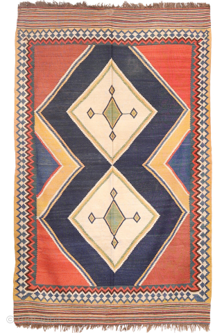 Antique minimalist Qashqai Kilim with Striking Blue
This remarkable 1920s Qashqai kilim is distinguished by the predominance of dark blue, achieved entirely with natural dyes. The weaver created a simple yet visually striking ...