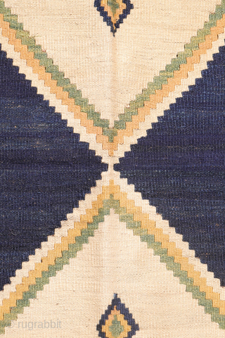 Antique minimalist Qashqai Kilim with Striking Blue
This remarkable 1920s Qashqai kilim is distinguished by the predominance of dark blue, achieved entirely with natural dyes. The weaver created a simple yet visually striking ...