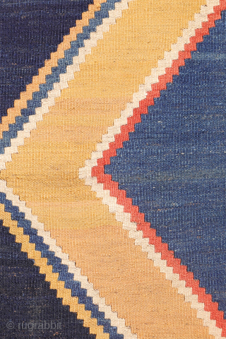 Antique minimalist Qashqai Kilim with Striking Blue
This remarkable 1920s Qashqai kilim is distinguished by the predominance of dark blue, achieved entirely with natural dyes. The weaver created a simple yet visually striking ...
