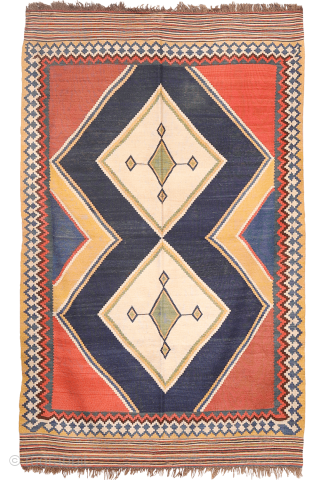 Antique minimalist Qashqai Kilim with Striking Blue
This remarkable 1920s Qashqai kilim is distinguished by the predominance of dark blue, achieved entirely with natural dyes. The weaver created a simple yet visually striking ...