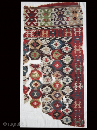 Kilim fragment cod. 0635. Wool. Eastern Anatolia. First half 19th. Century. Very good condition Cm. 86 x 180 (2’10” x 5’11”). Mounted on white linen. 
The star (olduz) is one of the  ...