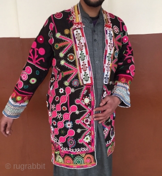 A Mangal man's woolen coat from Paktya Afghanistan 
It is made from a handwoven local patti cloth.The coat is decorated with woolen embroidery done with hand.       