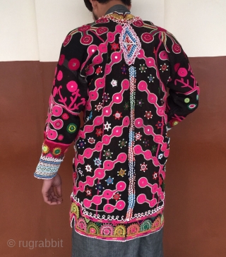 A Mangal man's woolen coat from Paktya Afghanistan 
It is made from a handwoven local patti cloth.The coat is decorated with woolen embroidery done with hand.       