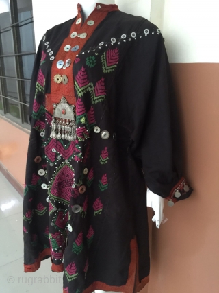 Tribal Jumlo wedding dress from Nuristan/kohistan valley.
Complete hand embroidery.nicely decorated with coins , buttons and real mother of pearl buttons.The centre of the dress has a very beautifull old Afghan pendant.Overall the  ...