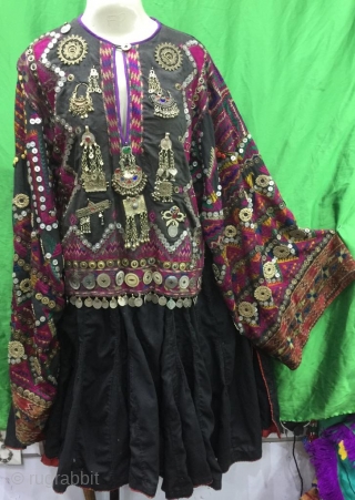 Tribal "Jumlo" wedding dress from Indus Kohistan valley of Pakistan.
The dress is completely hand embroidered with pure silk threads.
The dress is in its best condition.Very finely decorated with old pendants , mother  ...