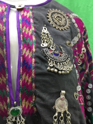 Tribal "Jumlo" wedding dress from Indus Kohistan valley of Pakistan.
The dress is completely hand embroidered with pure silk threads.
The dress is in its best condition.Very finely decorated with old pendants , mother  ...