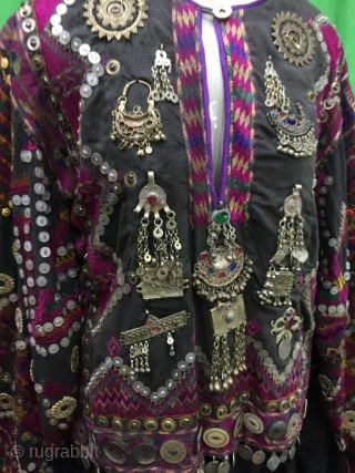Tribal "Jumlo" wedding dress from Indus Kohistan valley of Pakistan.
The dress is completely hand embroidered with pure silk threads.
The dress is in its best condition.Very finely decorated with old pendants , mother  ...