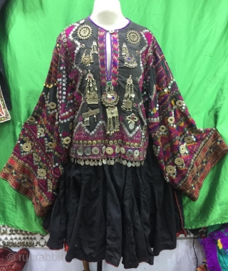 Tribal "Jumlo" wedding dress from Indus Kohistan valley of Pakistan.
The dress is completely hand embroidered with pure silk threads.
The dress is in its best condition.Very finely decorated with old pendants , mother  ...