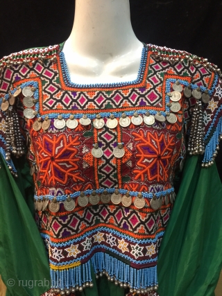 Tribal Pashtun nomadic vintage woman dress from Afghanistan.
Very finely hand embroidered , in excellent condition  
Measurements 
Length of the dress is 41 inches 
Bust 38 inches inches 
Sleeve 18 inches  