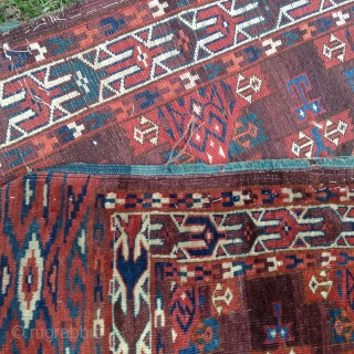 1850-1870 Turkoman Yomut rug; rectangular central field with rows of Kapsa gols, field framed by three borders with main one decorated with syrga design, minor borders displaying the saldat motif; end elem  ...
