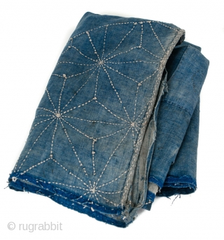 This is a boro futon cover repurposed from a larger wrapping cloth, or furoshiki, dyed with indigo to a solid pale blue known as asagi. Sashiko embroidery of chrysanthemum, pine bark, and  ...