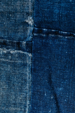 This is a boro futon cover, made up indigo dyed cottons that are first cut into re-usable pieces, and then patched together. 

As was customary in old Japan, cloth was recycled and  ...