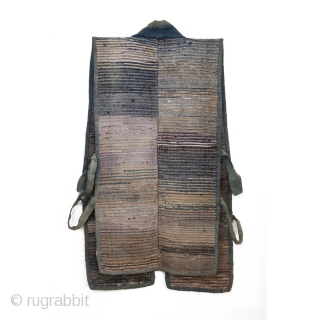 A well-worn cotton sodenashi, or work vest. It's weft is woven using shreds of fabric salvaged from other garments or cloth, with a cotton warp. Colors shift gracefully from faded neutrals to  ...