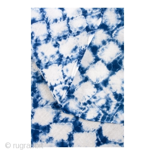 This a large swath of Japanese shibori cotton. Shibori is a Japanese term for several methods of dying cloth with a pattern by binding, stitching, folding, twisting, compressing, or capping. A simple  ...