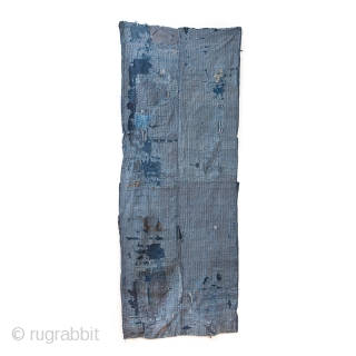 This is a large, heavily patched fragment of a Japanese boro futon cover. There are over sixty pieces of cloth on this textile, which have been sashiko stitched on top of one  ...