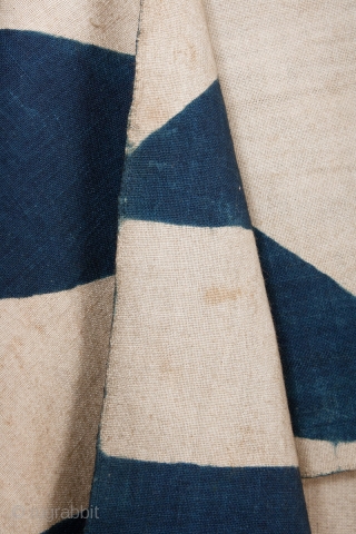 This is a large, Japanese antique indigo dyed cotton noren from the Meiji period. The fabric itself is made of thick, hand spun, and hand woven cotton. It is dyed with natural  ...