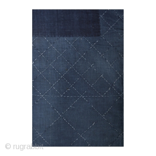 This is cotton noragi or Japanese worker's jacket. Made entirely of indigo, this noragi's hand-stitched sashiko design is a simple and geometric diamond pattern. From the characters sewn to the inside of  ...