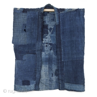 This is an antique boro sodenashi, or sleeveless vest. The intricately patched inside of this vest is what makes this piece truly unique. The inside back is made of a composite of  ...