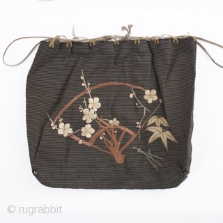 A charming silk bag which has been hand embroidered with a fan, cherry blossom and bamboo motif. Likely used to present a gift. There is one small hole in each of the  ...