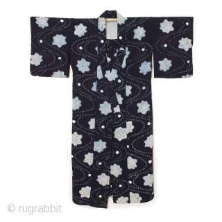 This is a Japanese indigo dyed cotton shibori kimono. A combination of shibori dying techniques are used to achieve this beautiful stream and maple leaf motif. The meandering stream pattern is made  ...